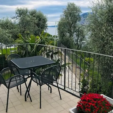 Апартаменты Gaia Con Piscina Seeblick Мальчезине